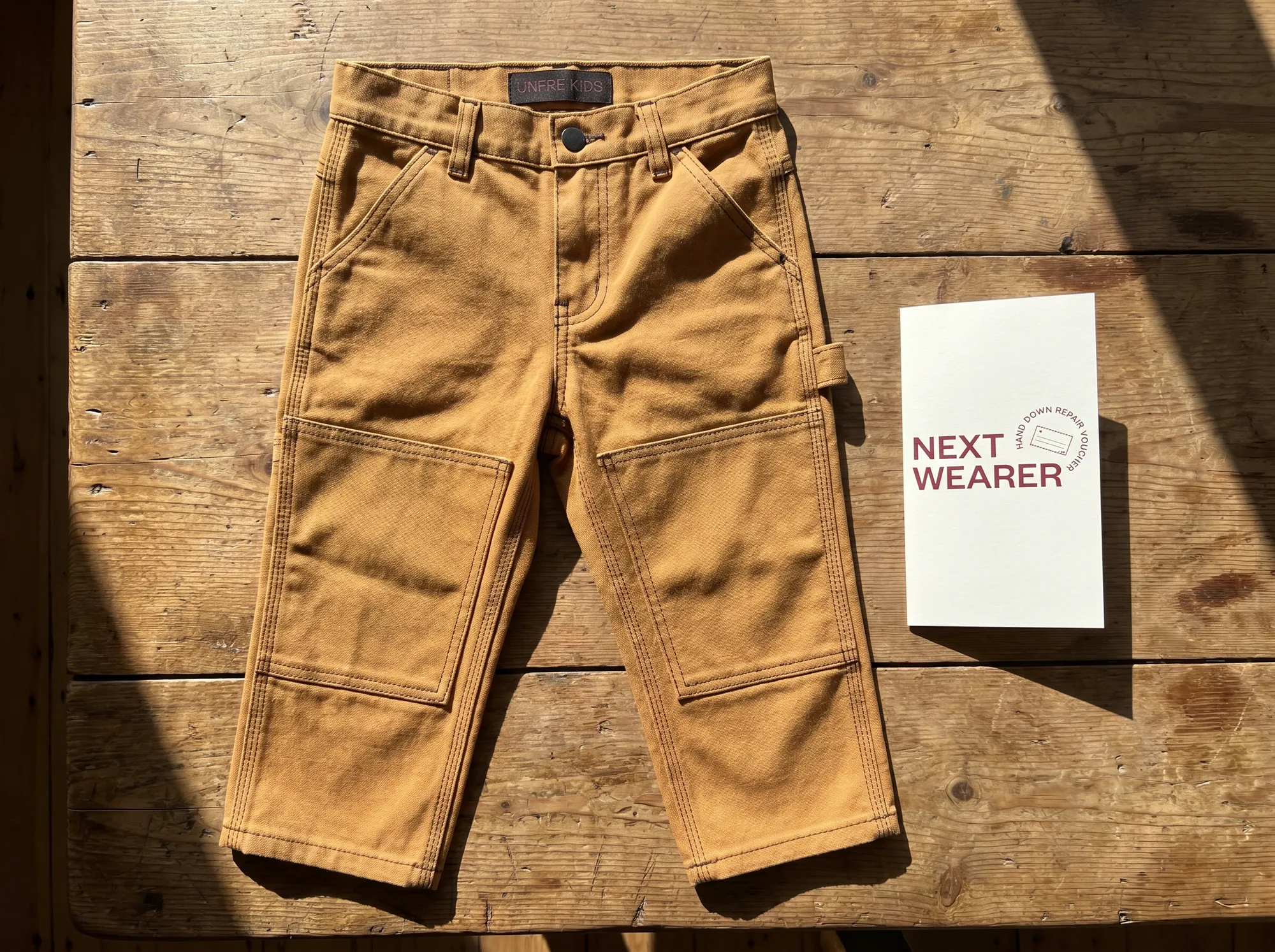 Unfre Kids Working Pant (Children's Built-To-Last Apparel) — A children's working pant in cotton canvas with reinforced knees and seat, hammer-loop placeholder for older kids, and a repair voucher.