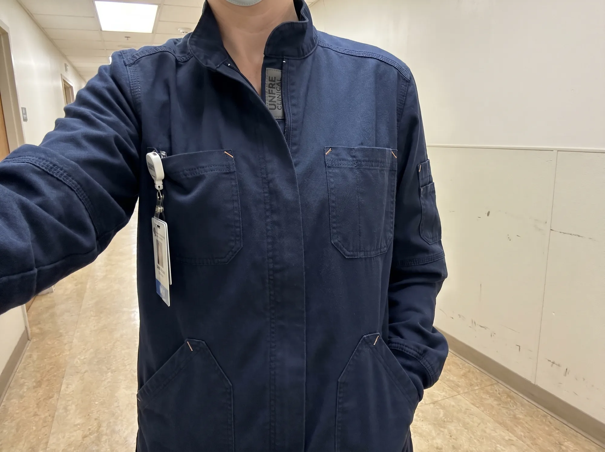 Unfre Clinical Jacket (Healthcare & Hospital Workwear) — A heavyweight long-sleeve scrub jacket for OR and procedural use, with reinforced cuffs and seams, six pockets, and a repair voucher.
