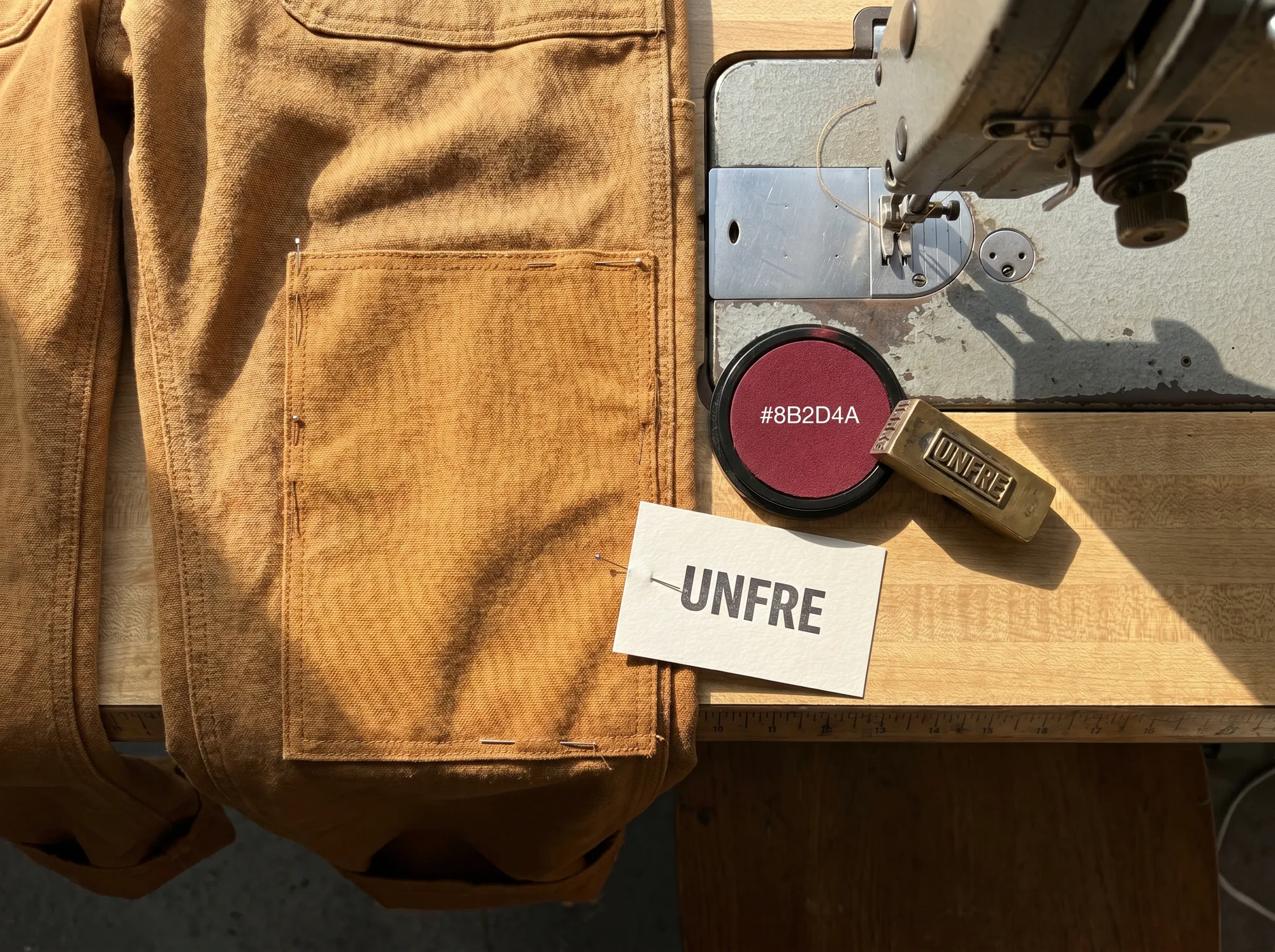 Unfre Panel Replacement (Repair-First Mending Service) — Flat-fee replacement of a worn panel — knee, seat, elbow, cuff — with the matching working fabric and double-needle seam attachment.